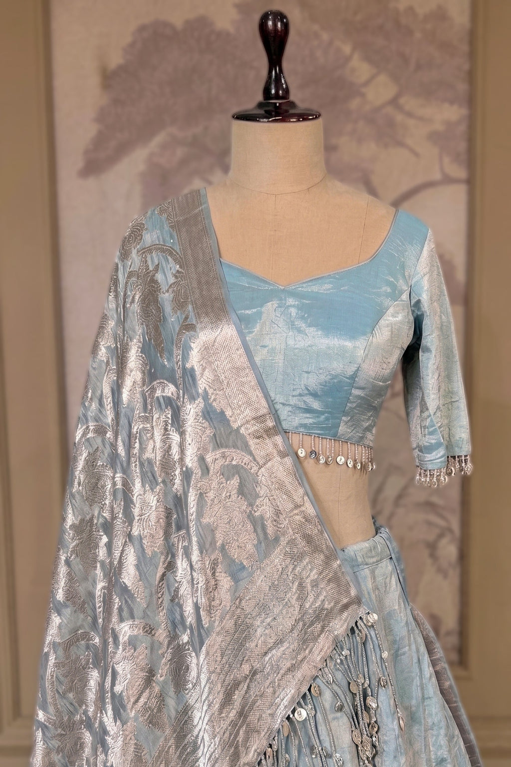 Icy Blue Metallic Tissue Silk Minimalist Lehenga Choli with Woven Banarasi Dupatta and Cowrie Shell Tassels