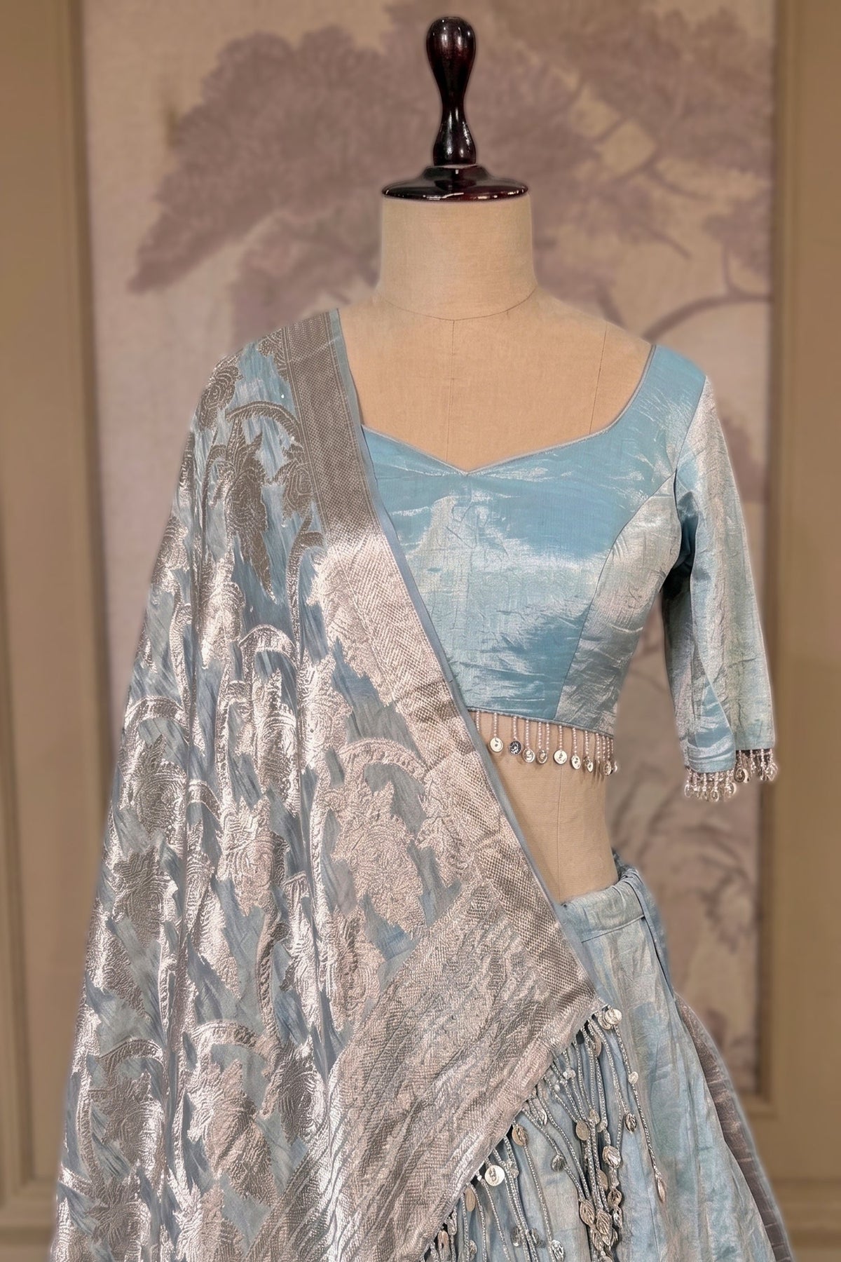 Icy Blue Metallic Tissue Silk Minimalist Lehenga Choli with Woven Banarasi Dupatta and Cowrie Shell Tassels