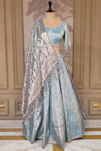 Icy Blue Metallic Tissue Silk Minimalist Lehenga Choli with Woven Banarasi Dupatta and Cowrie Shell Tassels