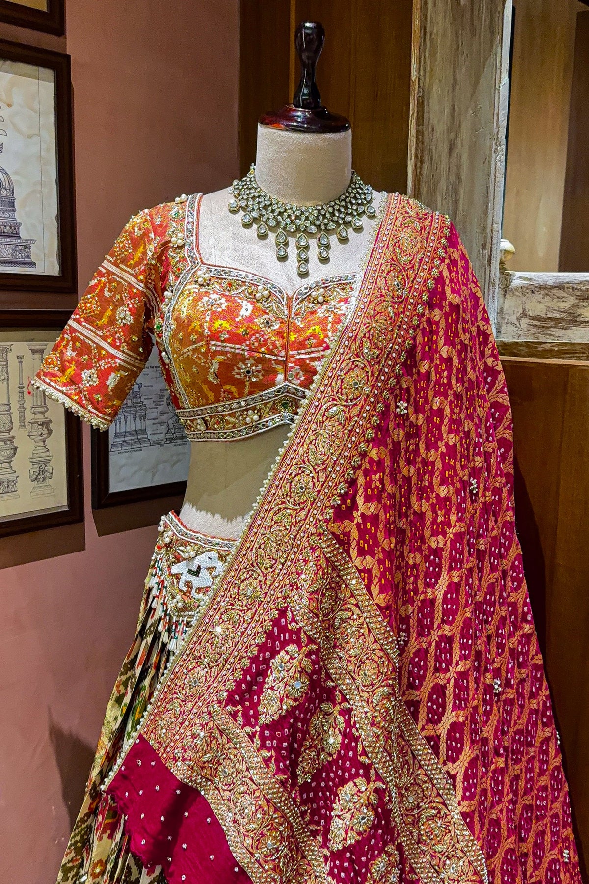 Cream and Golden Tissue Silk Heritage Patola Lehenga with Hand-Embroidered Zardosi Blouse and Georgette Bandhej Dupatta
