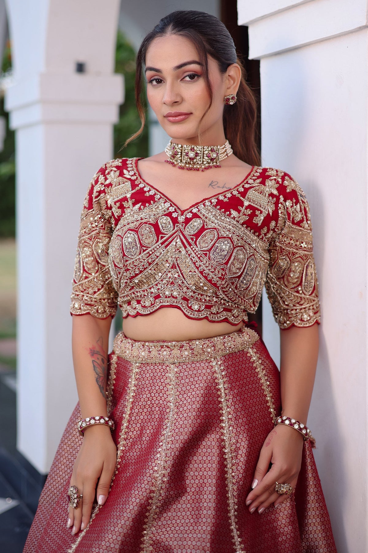 The Majestic Maroon Banarasi Silk Bridal Lehenga Ensemble with Jharokha Zardosi Blouse and Sheer Scalloped Veil