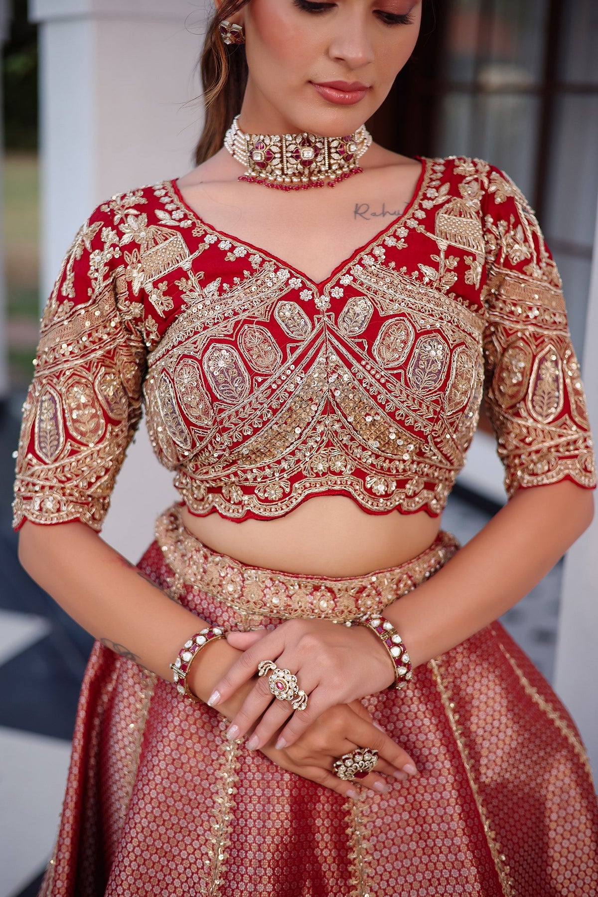 The Majestic Maroon Banarasi Silk Bridal Lehenga Ensemble with Jharokha Zardosi Blouse and Sheer Scalloped Veil