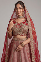The Majestic Maroon Banarasi Silk Bridal Lehenga Ensemble with Jharokha Zardosi Blouse and Sheer Scalloped Veil