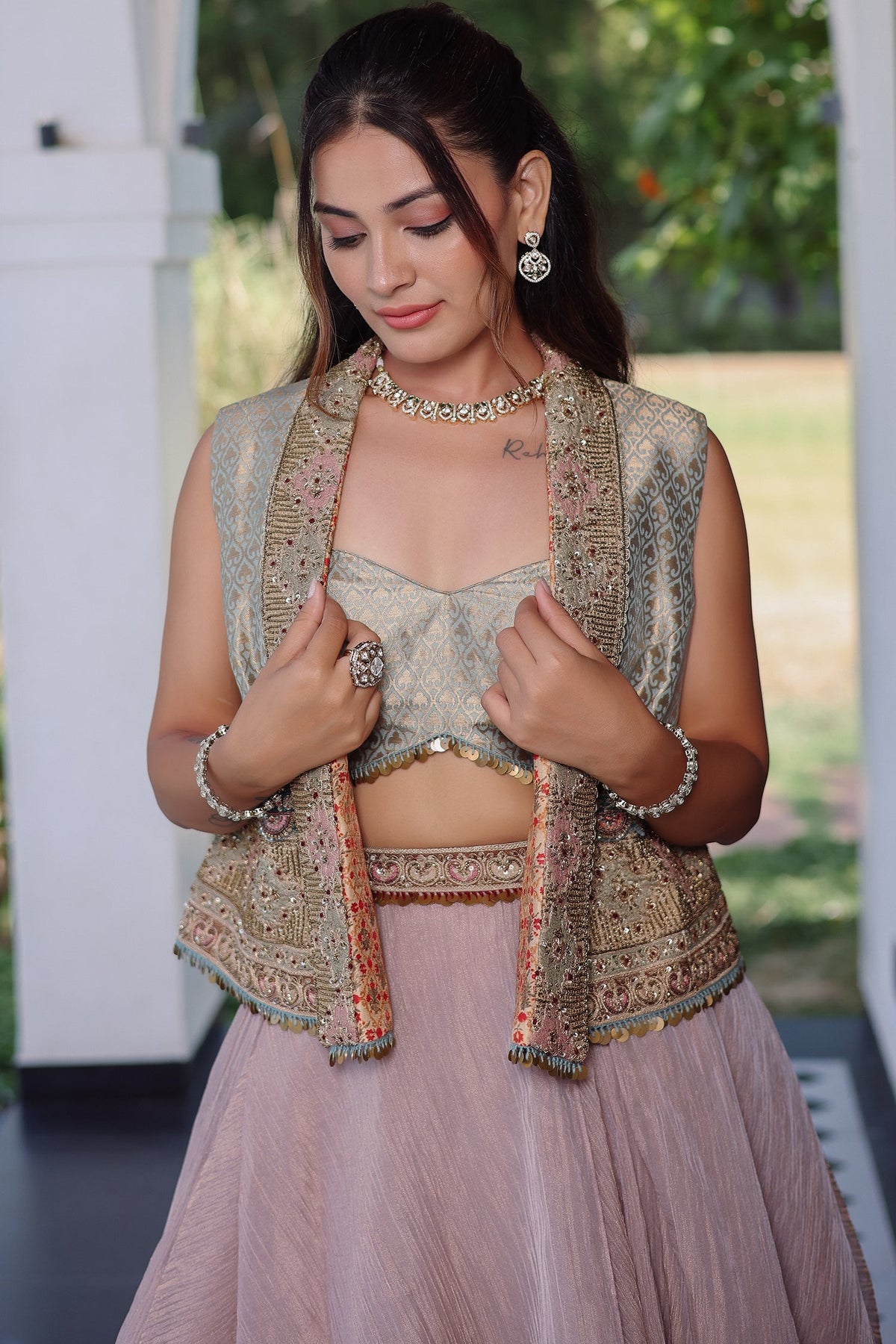 Muted Mauve Tissue Asymmetric Layered Lehenga Set With Heavily Embroidered Fusion Jacket
