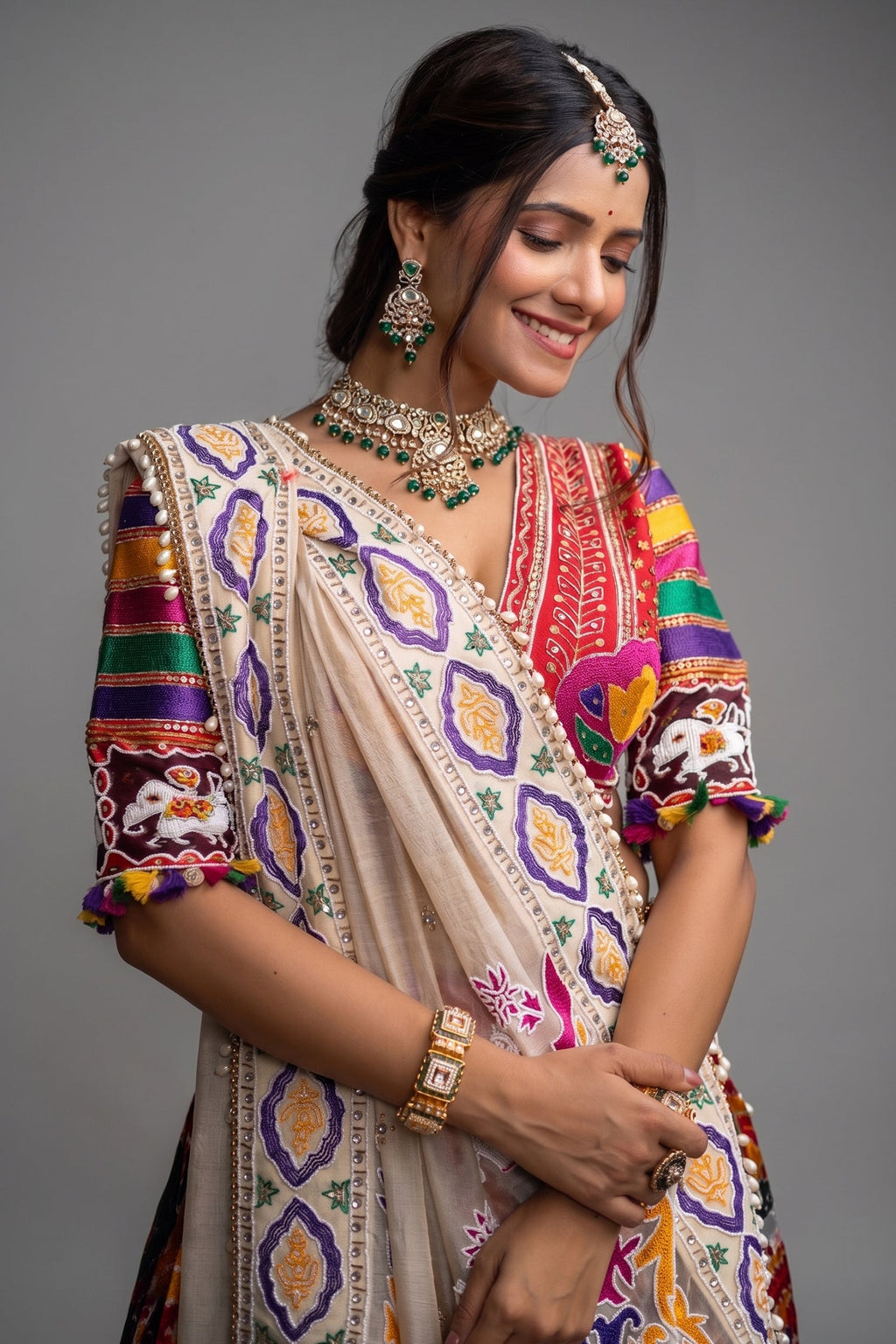 The Rajwadi Patola Silk Lehenga Ensemble With Scalloped V-Neck Hand-Embellished Blouse And Sheer Organza Tissue Dupatta
