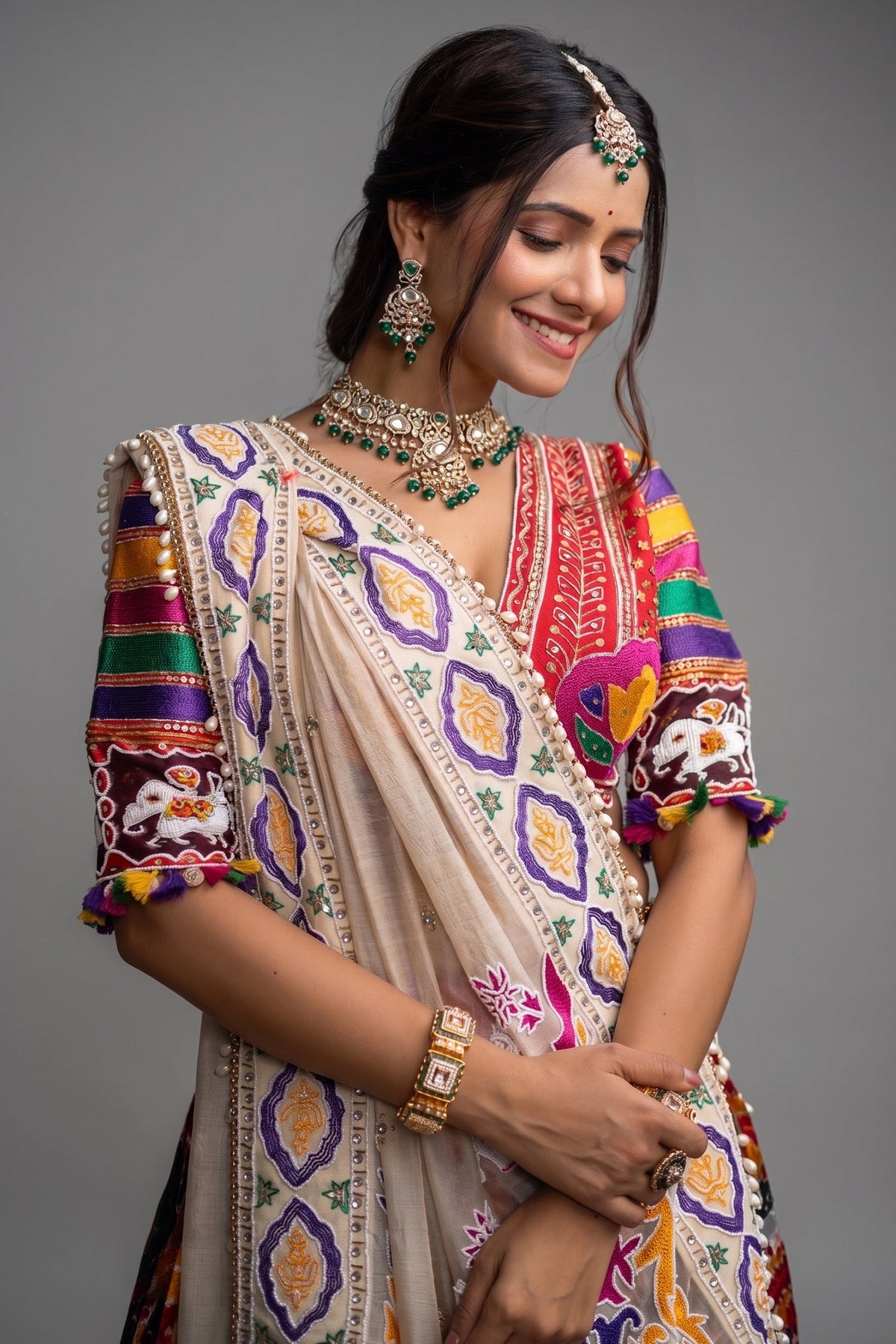 The Rajwadi Patola Silk Lehenga Ensemble With Scalloped V-Neck Hand-Embellished Blouse And Sheer Organza Tissue Dupatta