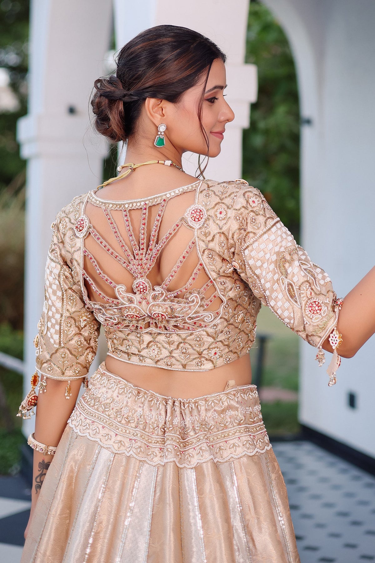 The Imperial Gold Jacquard Brocade Woven Silk Kalidar Lehenga Ensemble with Handcrafted Jewel Blouse and All-Over Cutwork Tissue Dupatta