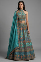 Firuza Blue Silk Pichwai Printed Lehenga with Mirror and Sequin Embroidered Halter Blouse