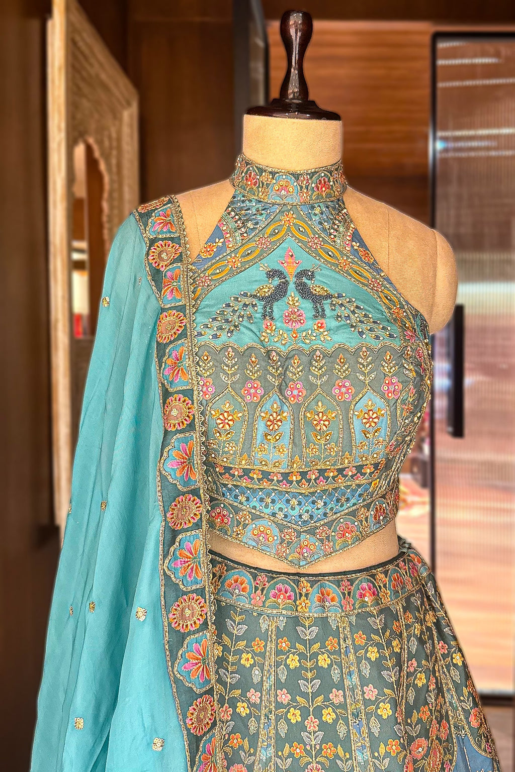 Firuza Blue Silk Pichwai Printed Lehenga with Mirror and Sequin Embroidered Halter Blouse