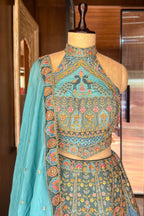 Firuza Blue Silk Pichwai Printed Lehenga with Mirror and Sequin Embroidered Halter Blouse