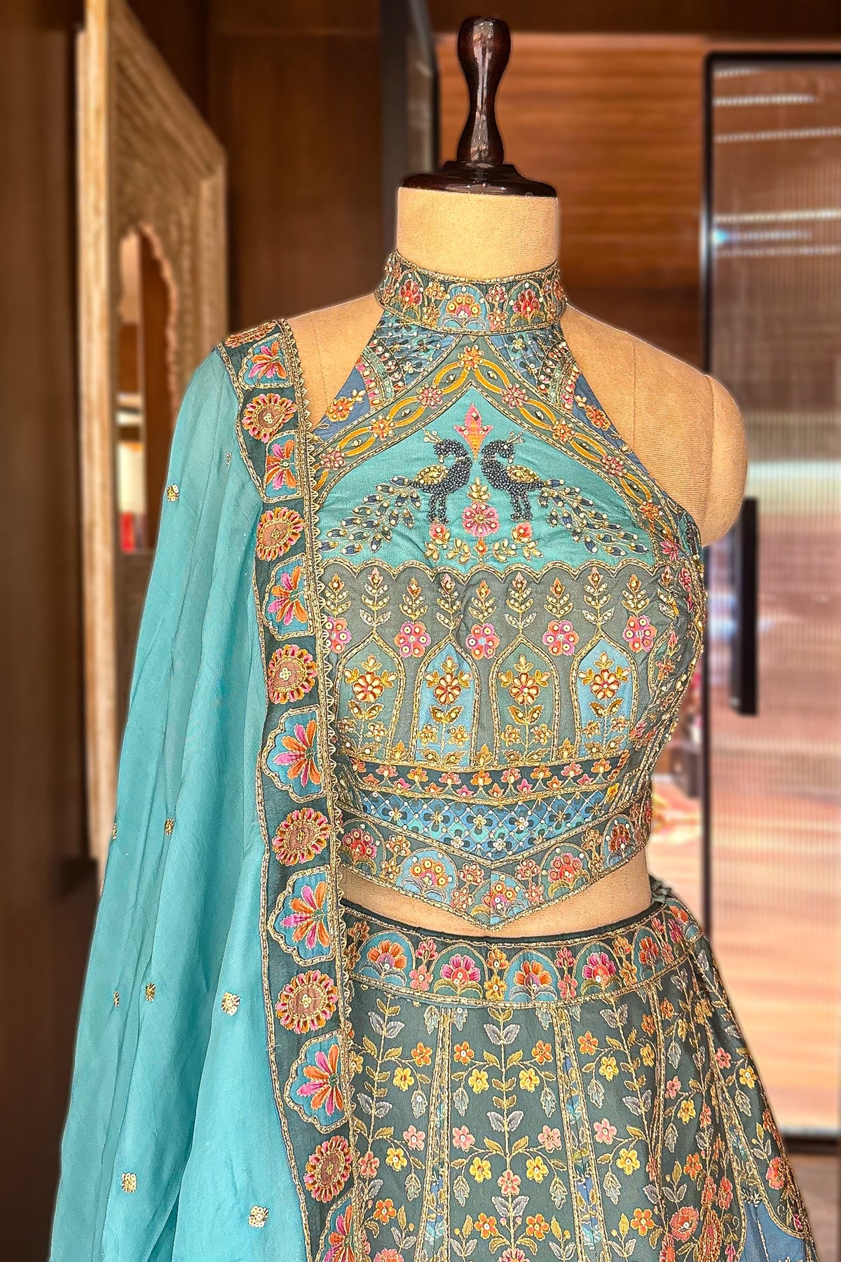 Firuza Blue Silk Pichwai Printed Lehenga with Mirror and Sequin Embroidered Halter Blouse