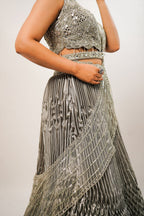 Metallic Green Smocked Satin Lehenga Set with Mirror-Embellished High-Neck Blouse
