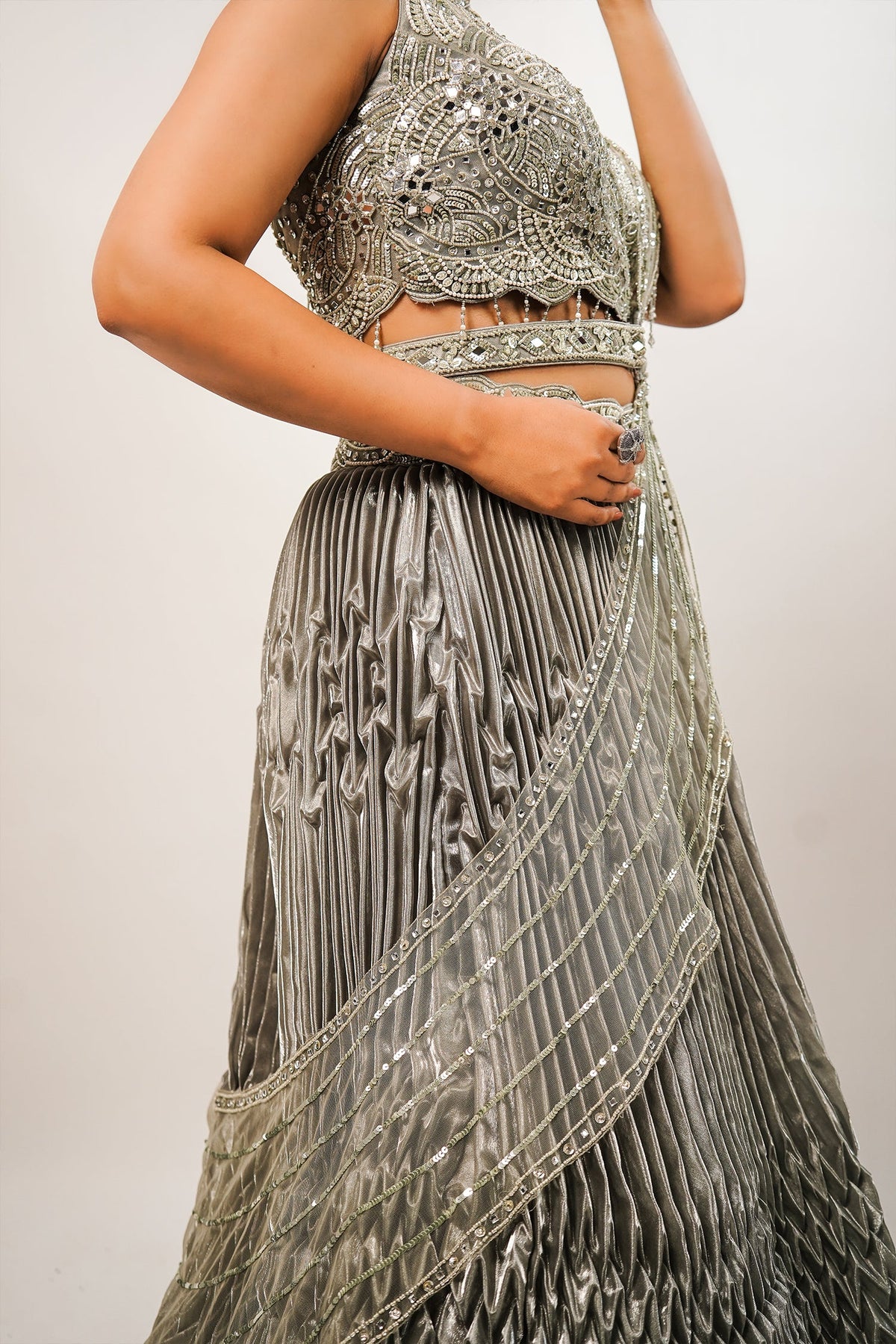 Metallic Green Smocked Satin Lehenga Set with Mirror-Embellished High-Neck Blouse