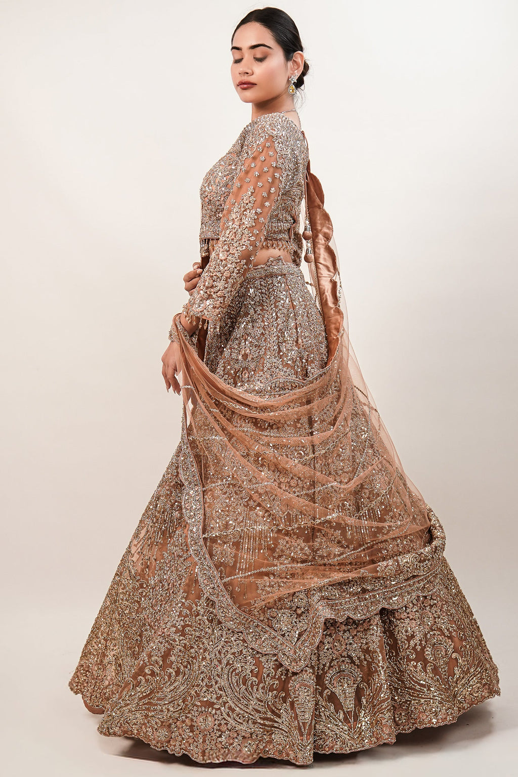Rose Gold Beige Net Lehenga with Heavily Handcrafted Work