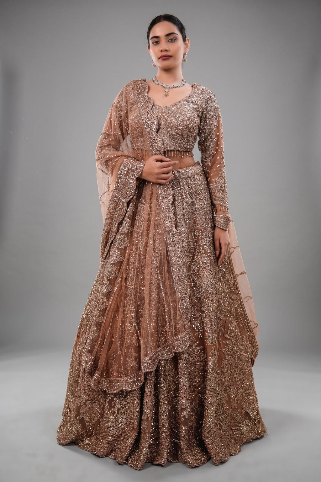 Rose Gold Beige Net Lehenga with Heavily Handcrafted Work
