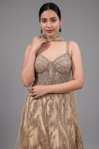 Champagne Beige Net Lehenga featuring Linear Sequin Trails and Beaded Tassel Bustier