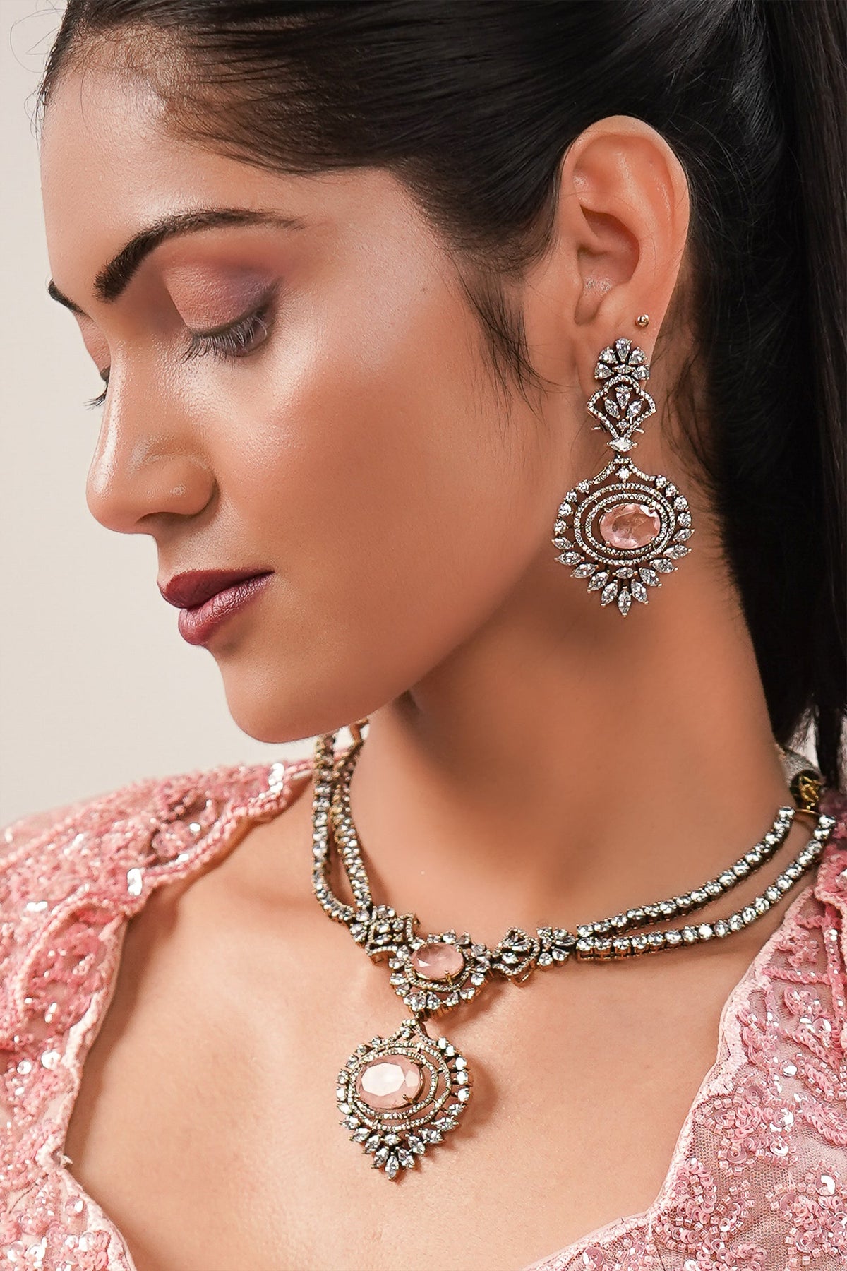 Blossom Pink Net Lehenga featuring Hand-Embellished V-Neck Blouse with Hanging Beads