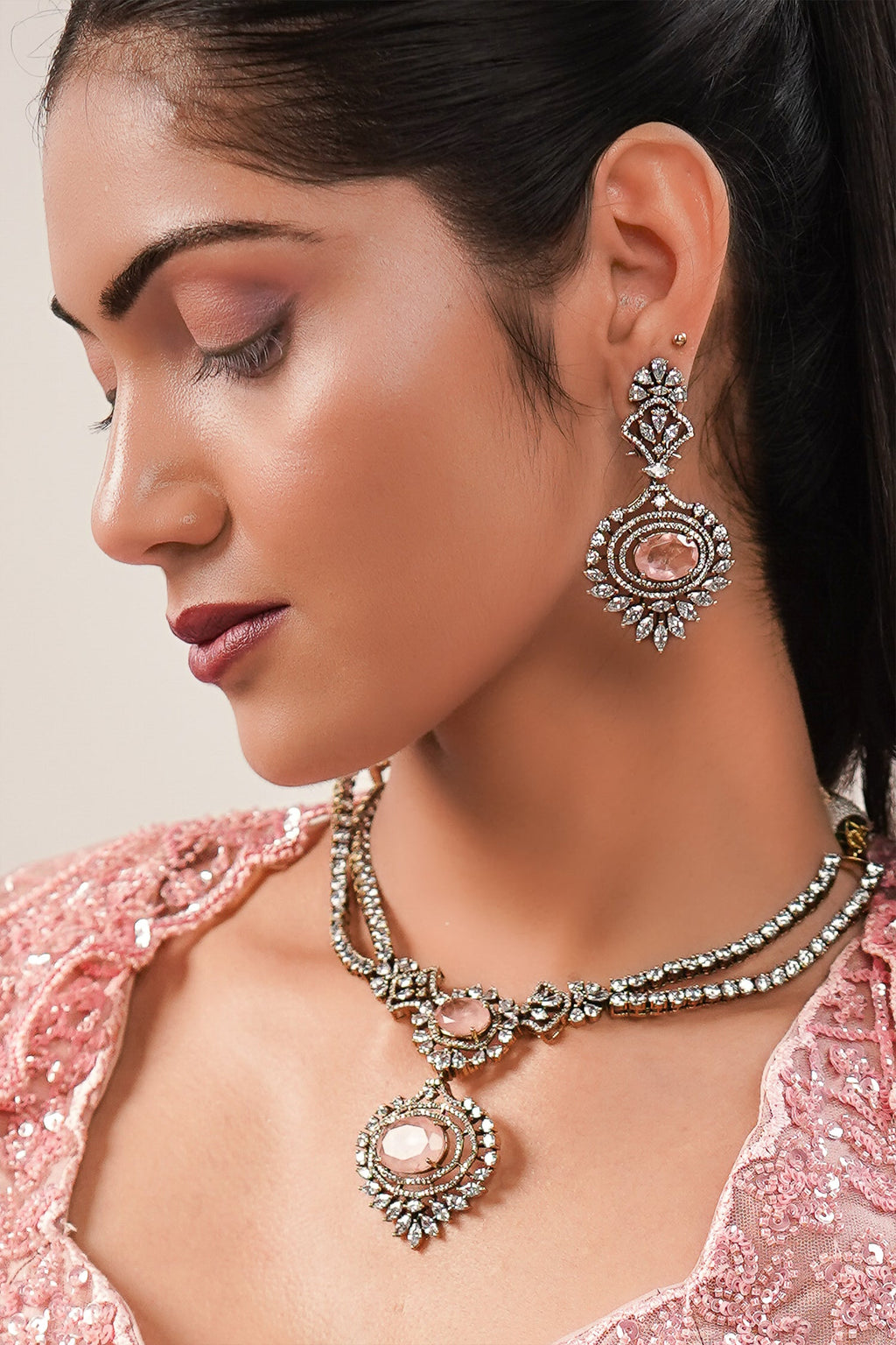 Blossom Pink Net Lehenga featuring Hand-Embellished V-Neck Blouse with Hanging Beads