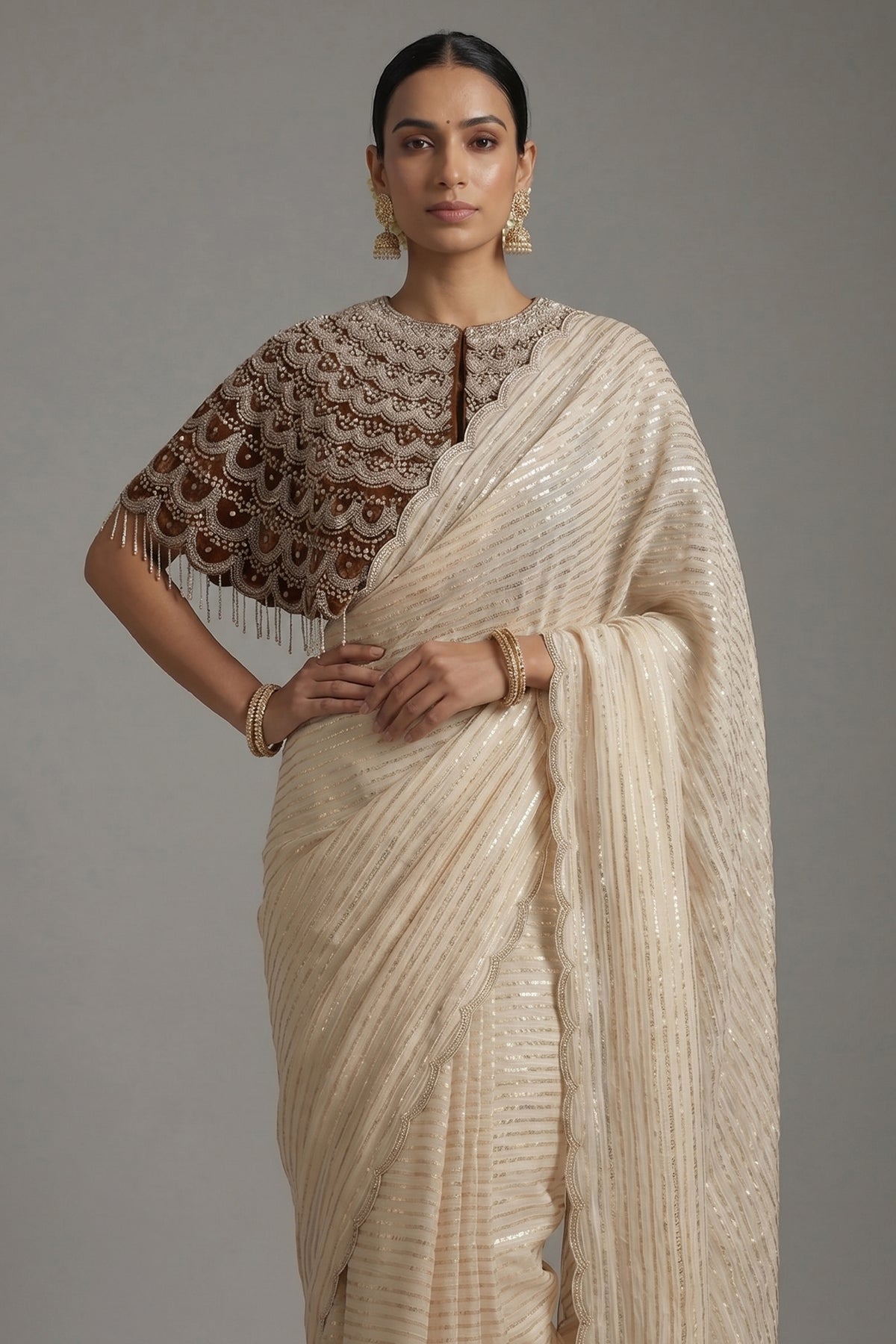 Cream Soft Organza Silk Weaving Stripe Saree with Poncho Blouse and Cutdana Work Scallop Border