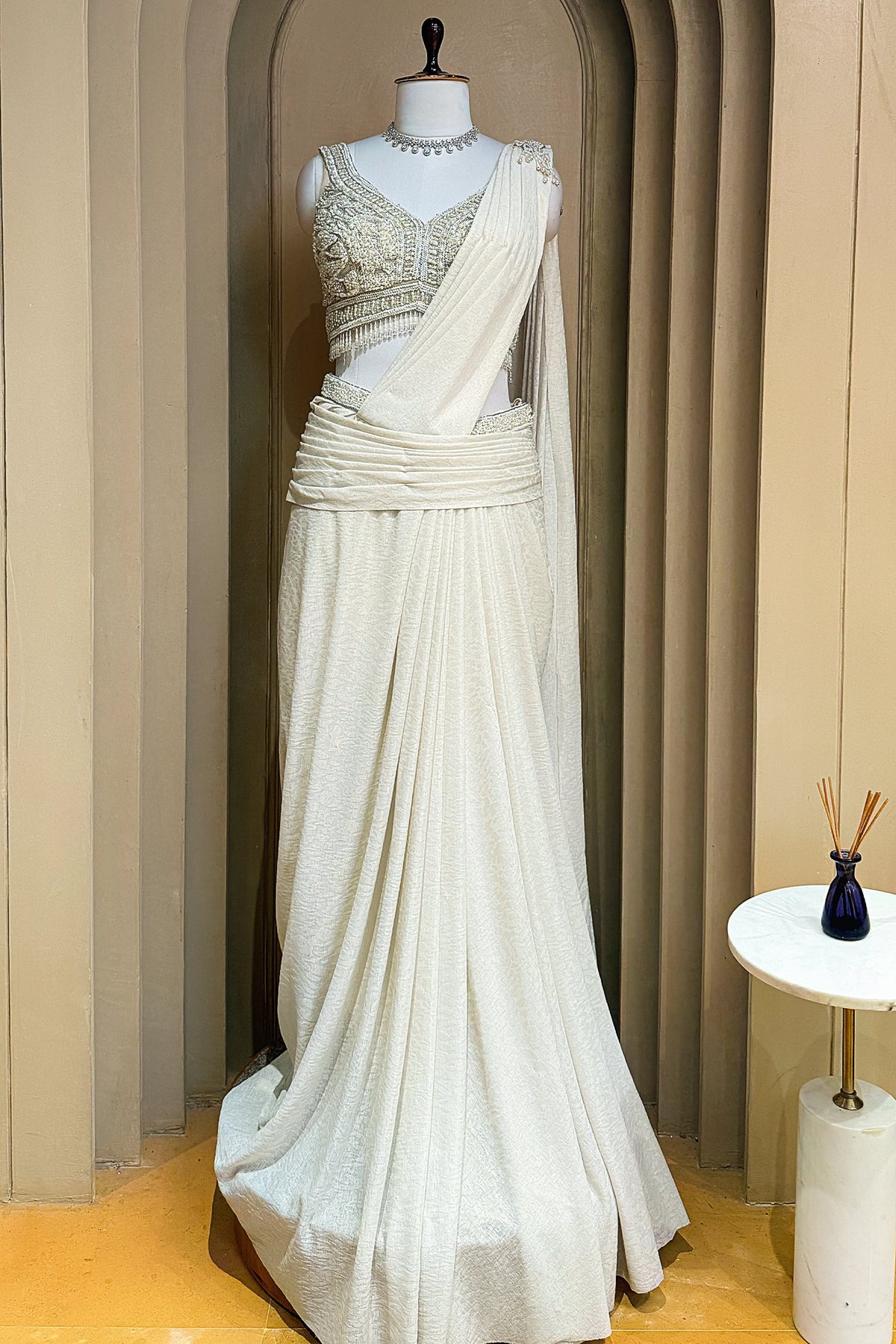 Off White Imported Lycra Readymade Saree with Cutdana and Diamond Work