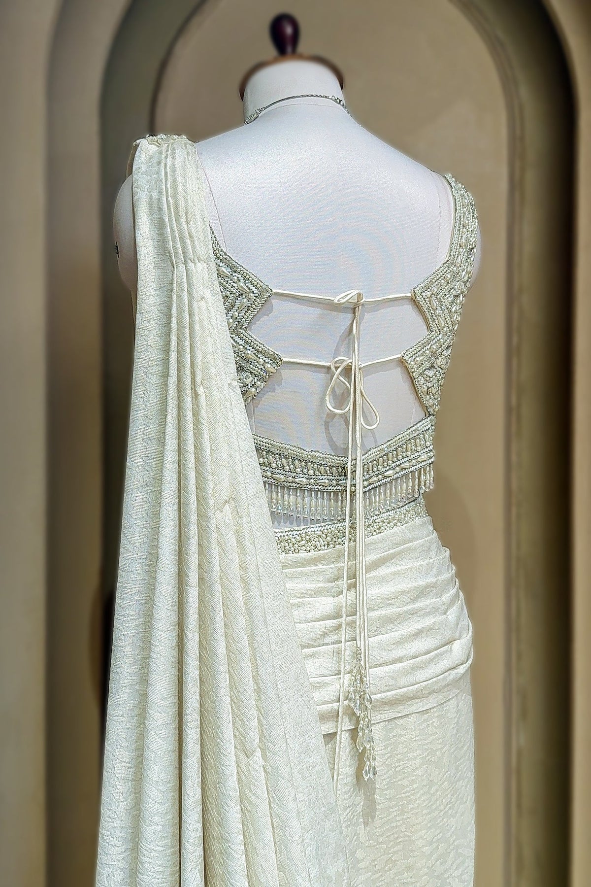 Off White Imported Lycra Readymade Saree with Cutdana and Diamond Work
