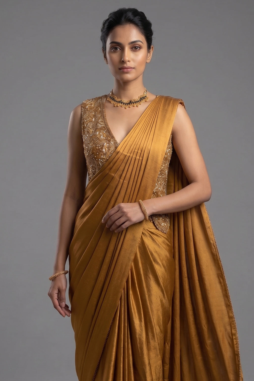 Golden Satin Silk Pre Draped Saree with Cutdana and Pearl Worked Jacket