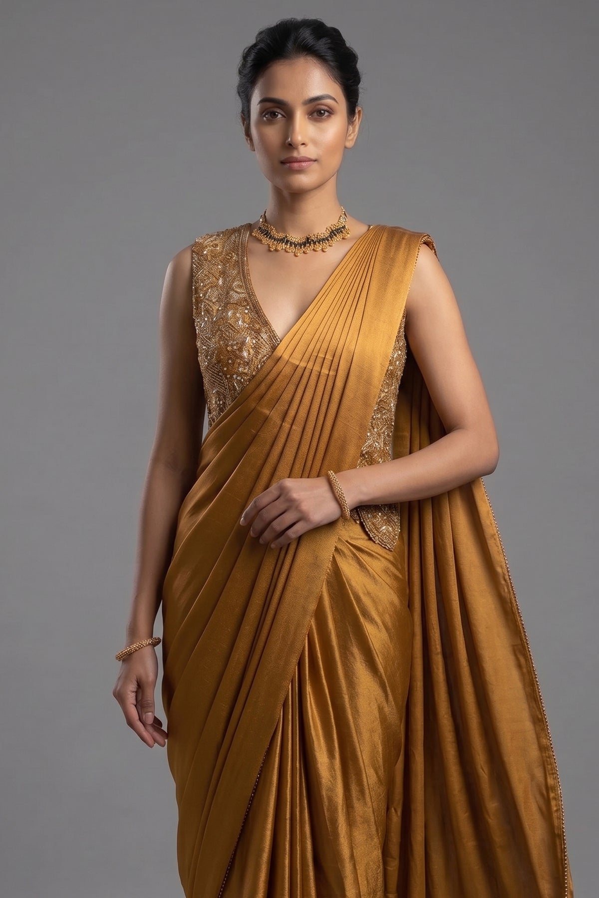 Golden Satin Silk Pre Draped Saree with Cutdana and Pearl Worked Jacket