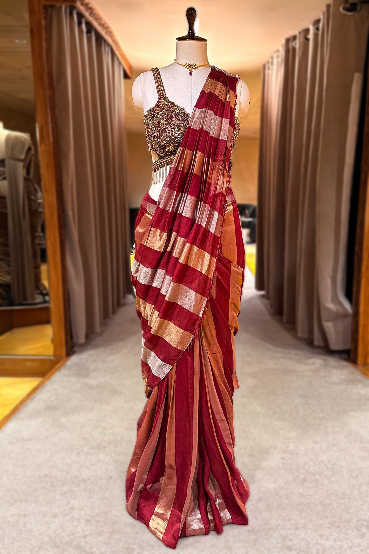 Maroon and Gold Striped Saree with Heavily Embellished Blouse