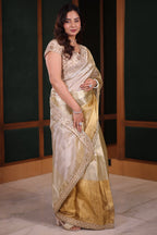 Dual-Tone Silver Golden Tissue Saree Featuring Intricate Handwork Lace Border With Coordinated Heavy Blouse