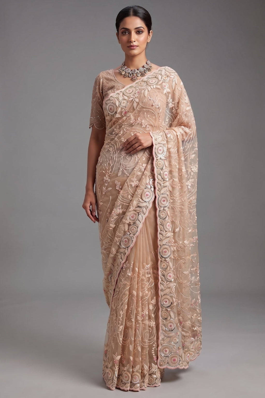 Beige Net Designer Saree Enriched With Glamorous Sequins And Cutdana Hand Embroidery