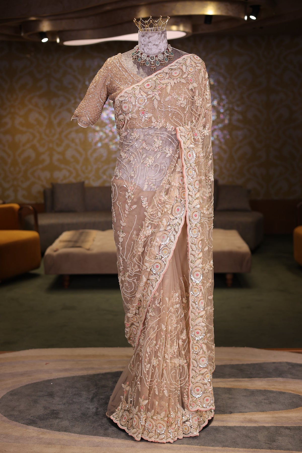Beige Net Designer Saree Enriched With Glamorous Sequins And Cutdana Hand Embroidery