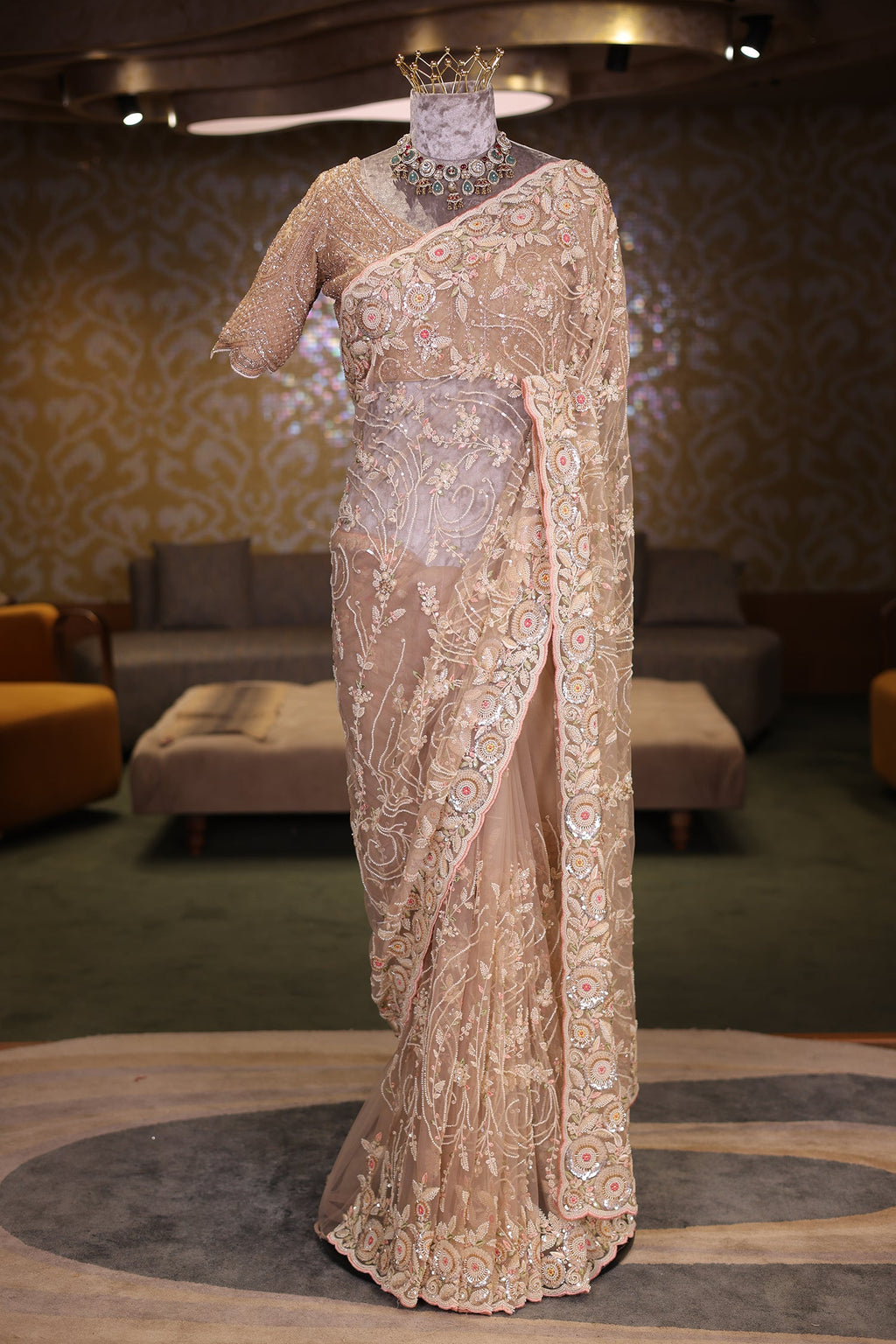 Beige Net Designer Saree Enriched With Glamorous Sequins And Cutdana Hand Embroidery