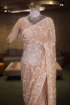 Beige Net Designer Saree Enriched With Glamorous Sequins And Cutdana Hand Embroidery