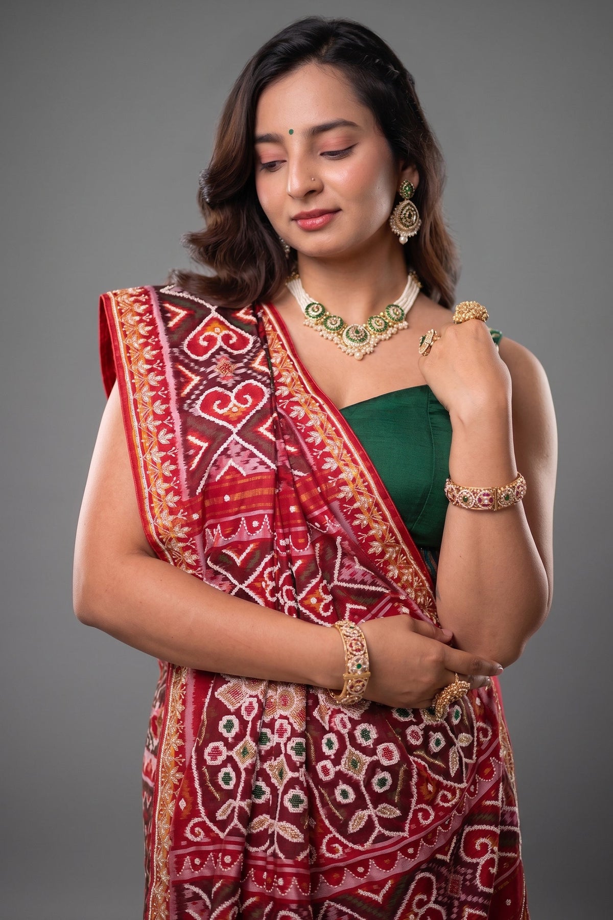 Red Silk Saree with Woven Patola and Handcrafted Cutdana and Bead Work Embroidery
