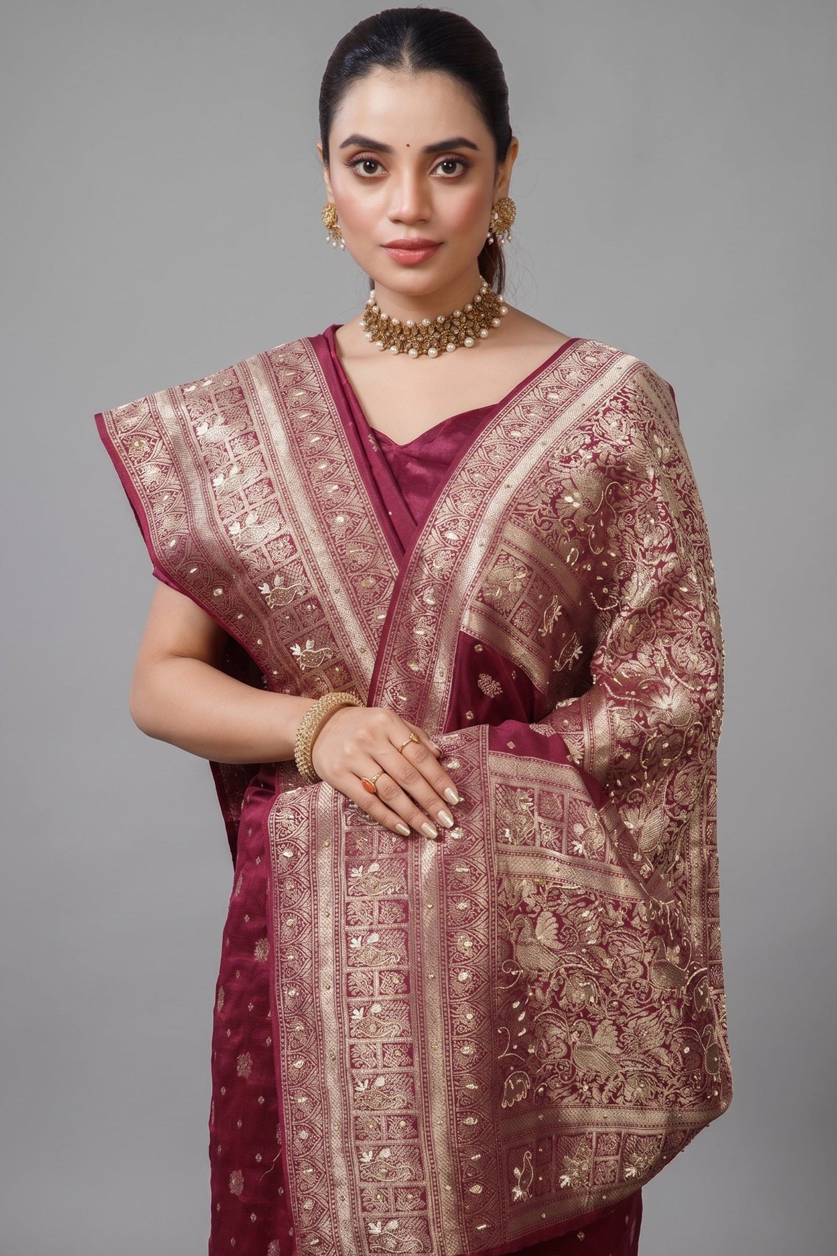 Close-up of the stunning handworked pallu and border on the Magenta Dola Silk All Over Woven Saree