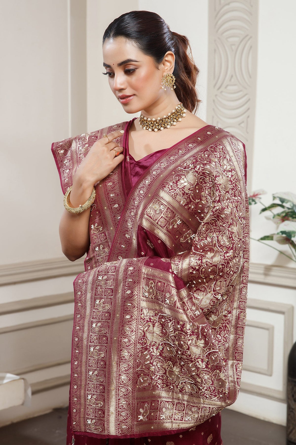 Magenta Dola Silk All Over Woven Saree styled with traditional jewelry
