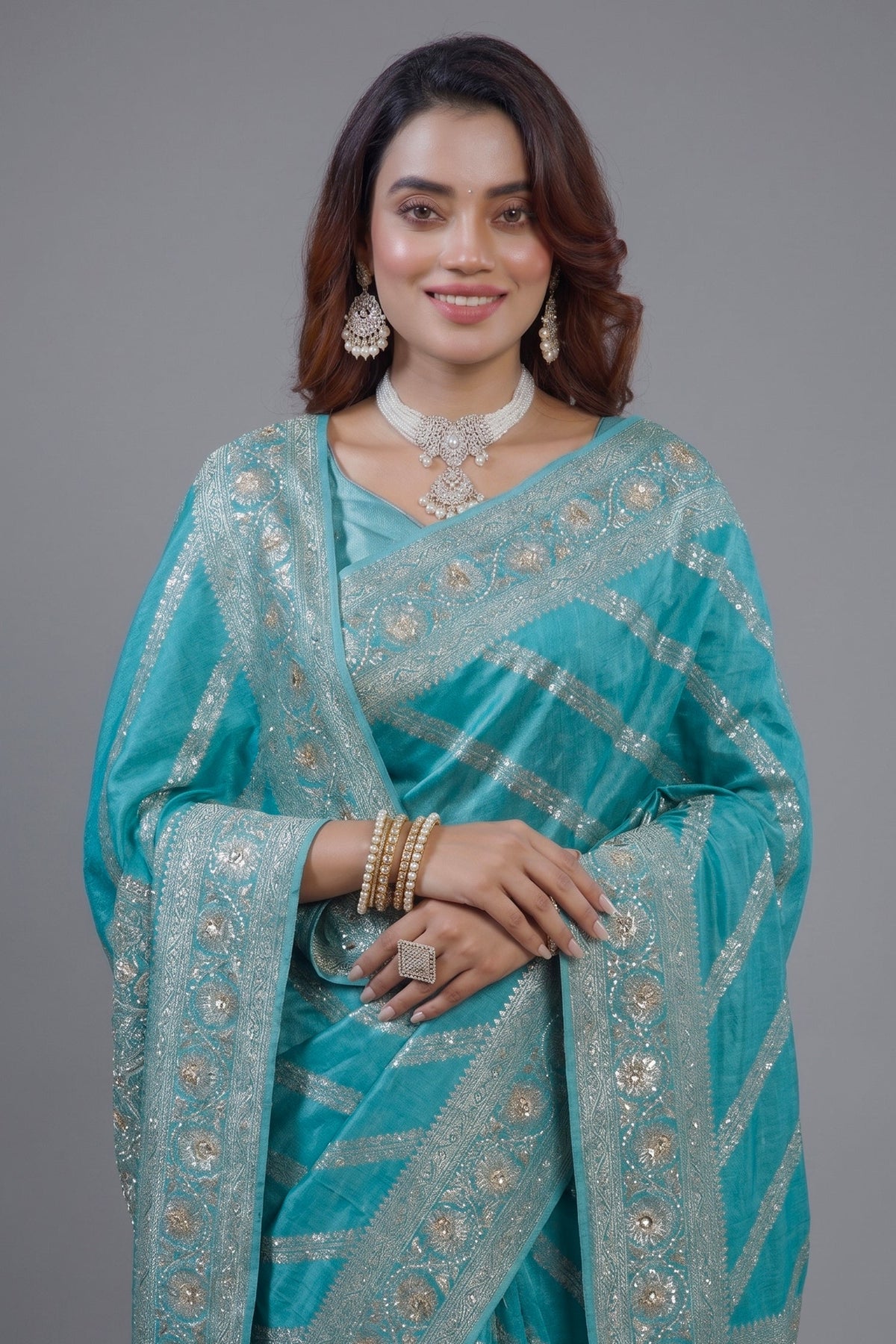 Close-up of intricate beaded details and gota work on the Sky Blue Dola Silk Lehehriya Saree