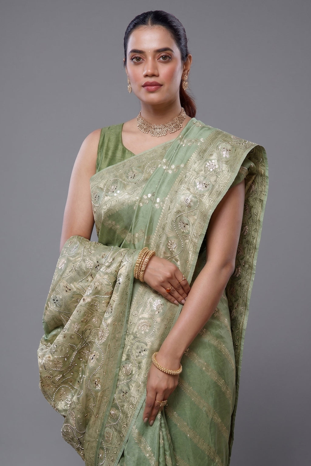 Close-up of intricate beaded details and gota work on the Light Pista Dola Silk Lehehriya Saree
