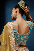 Mustard Gold Saree With Contrasting Turquoise Blue Embroidered Blouse In Cutdana Work