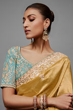 Mustard Gold Saree With Contrasting Turquoise Blue Embroidered Blouse In Cutdana Work