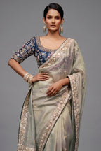 Pastel Mint Grey Organza Saree with Midnight Blue Peacock Embroidered Blouse