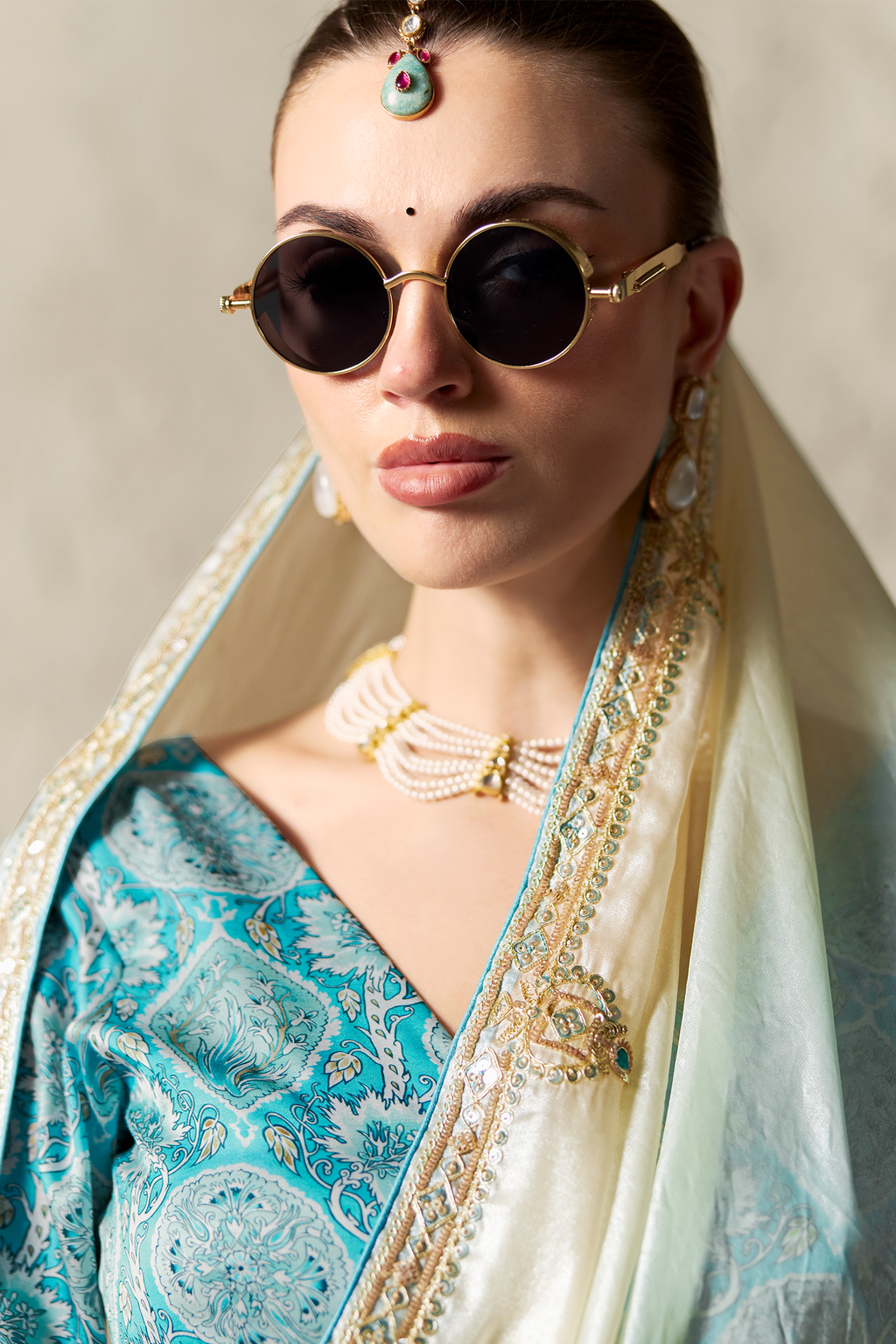 Ombre Sky Blue Tissue Saree Embellished With Sequins And Paired With A Matching Azure Print Blouse.