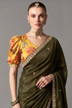 Deep Olive Green Organza Saree Highlighted With Sequins
