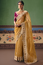 Honey Mustard Organza Saree Showcasing Heavy Border Work
