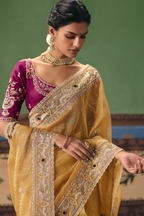 Honey Mustard Organza Saree Showcasing Heavy Border Work