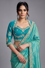 Turquoise Blue Zari Organza Satin Saree Showcasing Applique Flowers