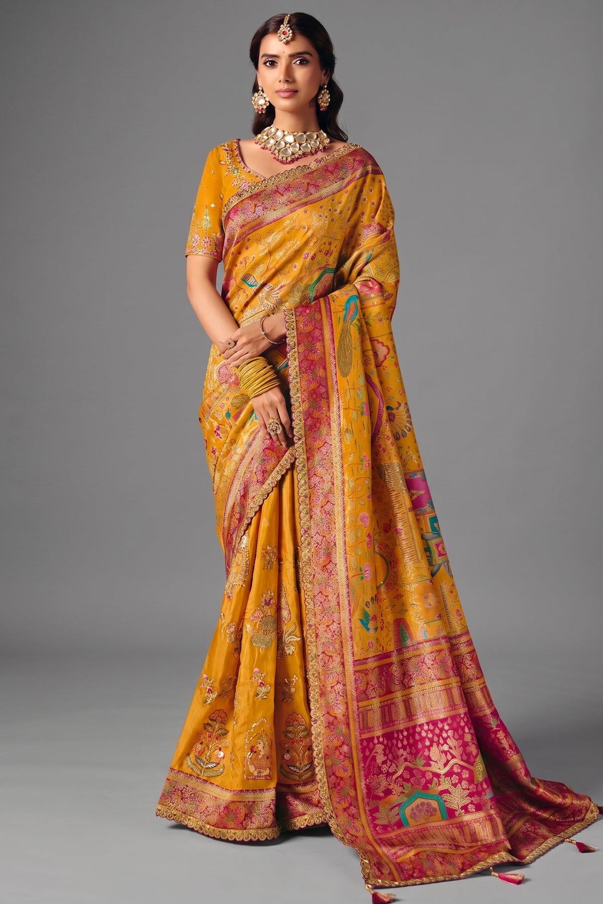 Turmeric Yellow Dola Silk Saree with Rich Pink Embroidered Contrasts