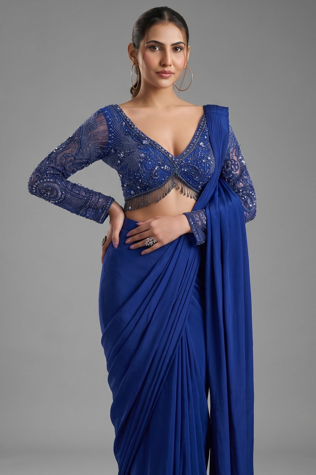 Indigo Blue Crepe Silk Pre-Draped Saree featuring Heavily Hand-Embellished V-Neck Full Sleeve Blouse