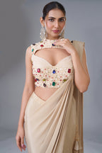 Champagne Beige Satin Crepe Pre-Draped Saree featuring Keyhole Cutout Choli Heavily Encrusted with Jewels