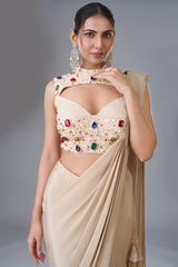 Champagne Beige Satin Crepe Pre-Draped Saree featuring Keyhole Cutout Choli Heavily Encrusted with Jewels